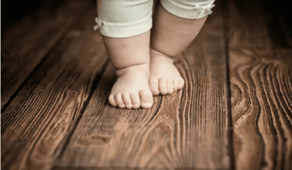 baby taking first steps
