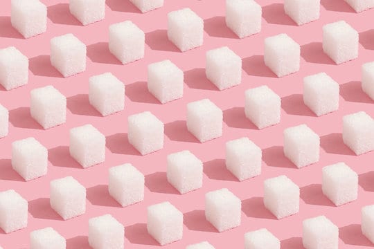 sugar cubes on pink background